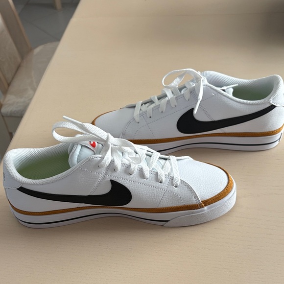 Nike women’s White and Black Sneakers with Gold Accents - Picture 2 of 8